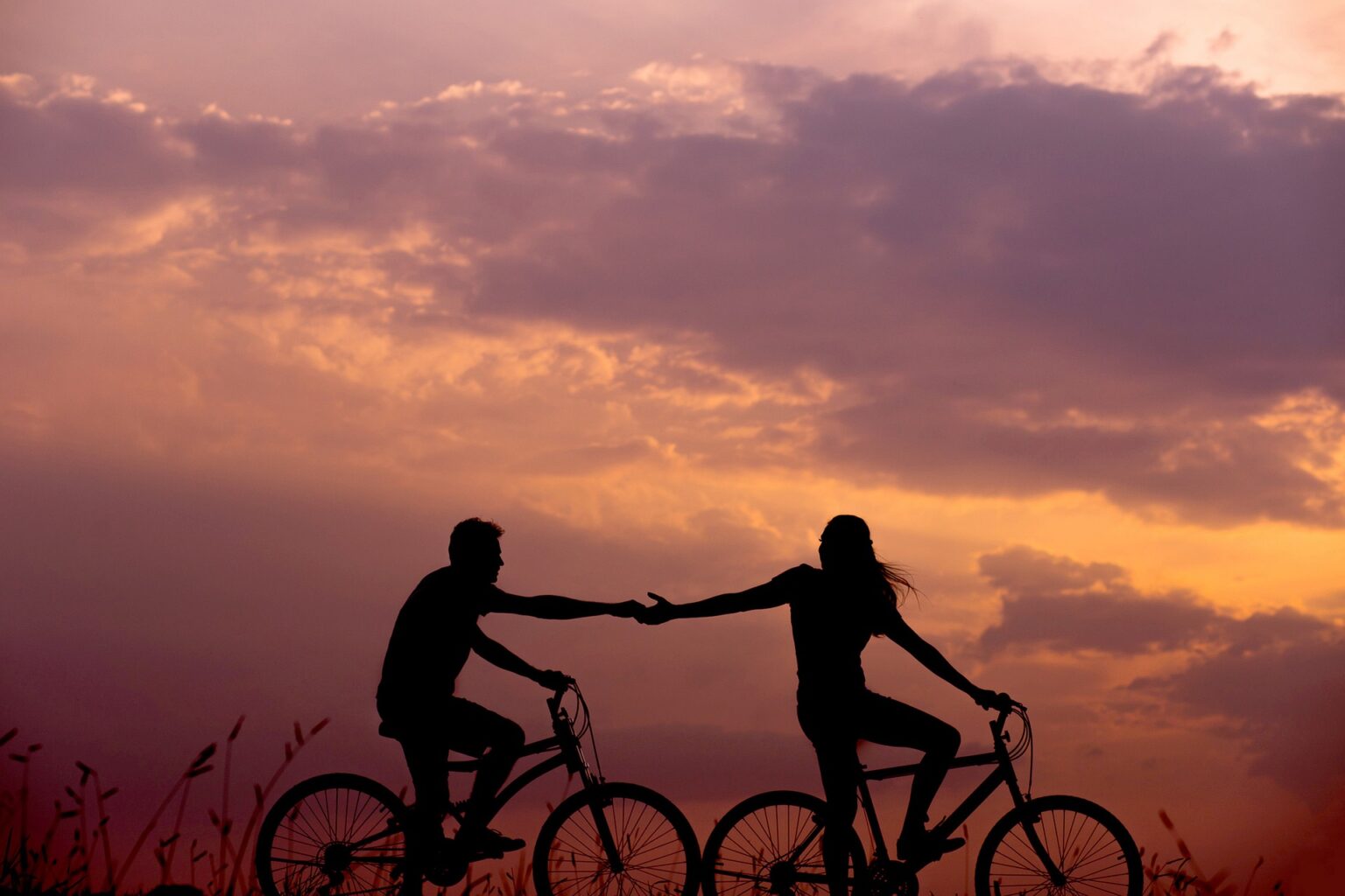 A romantic cycling getaway at sunset