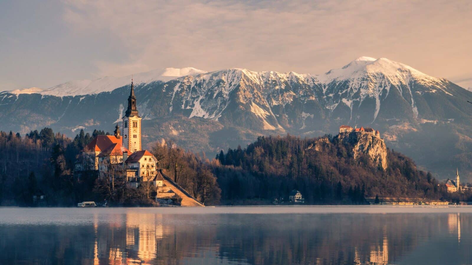 Lake Bled with snowy mountains in the background