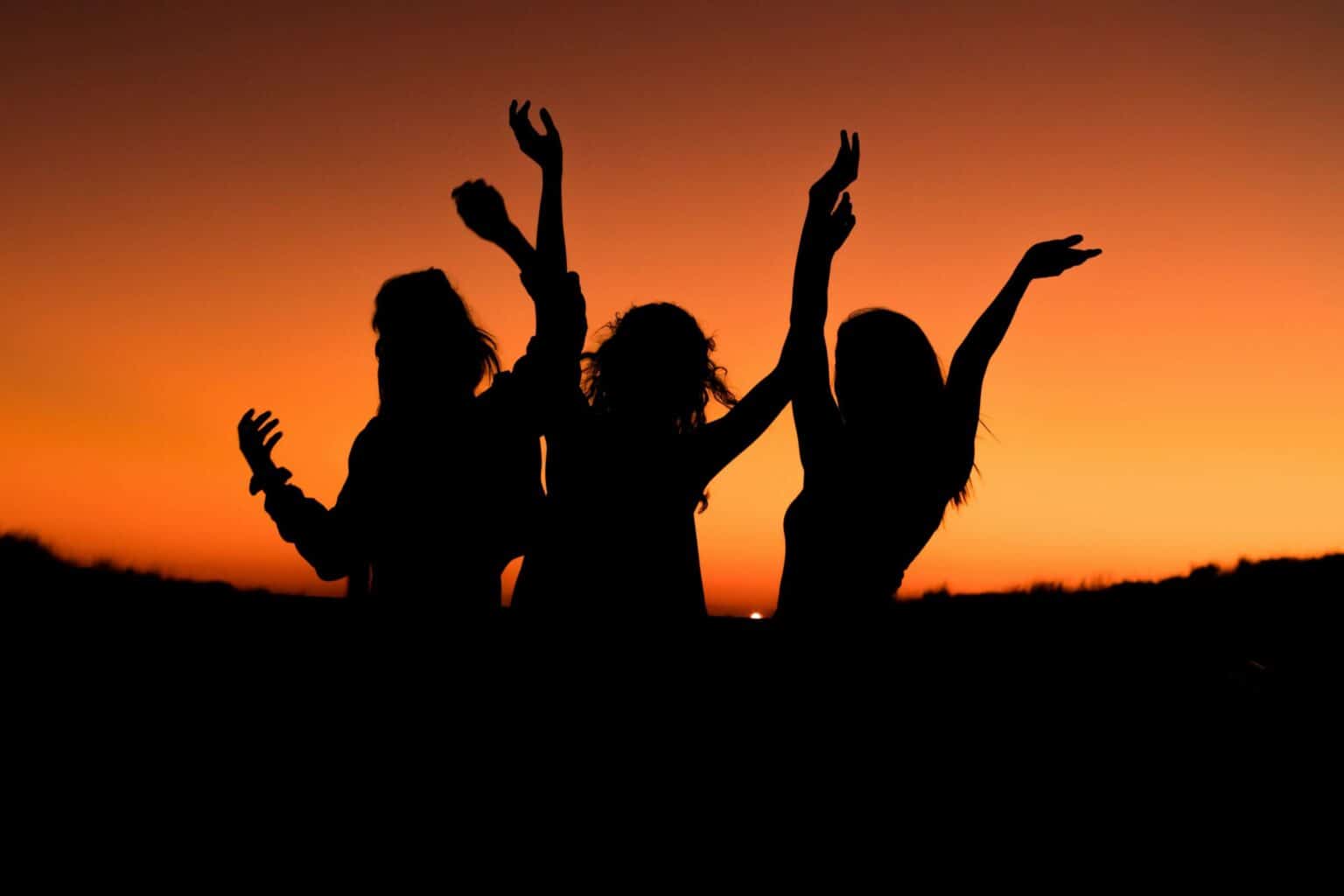 Girls dancing at sunset